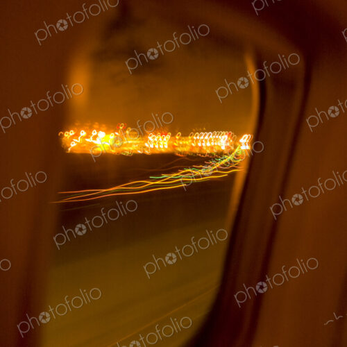 Plane window view of landing on a runway, lights beside the runway. Plane window view of landing on a runway, lights beside the runway.