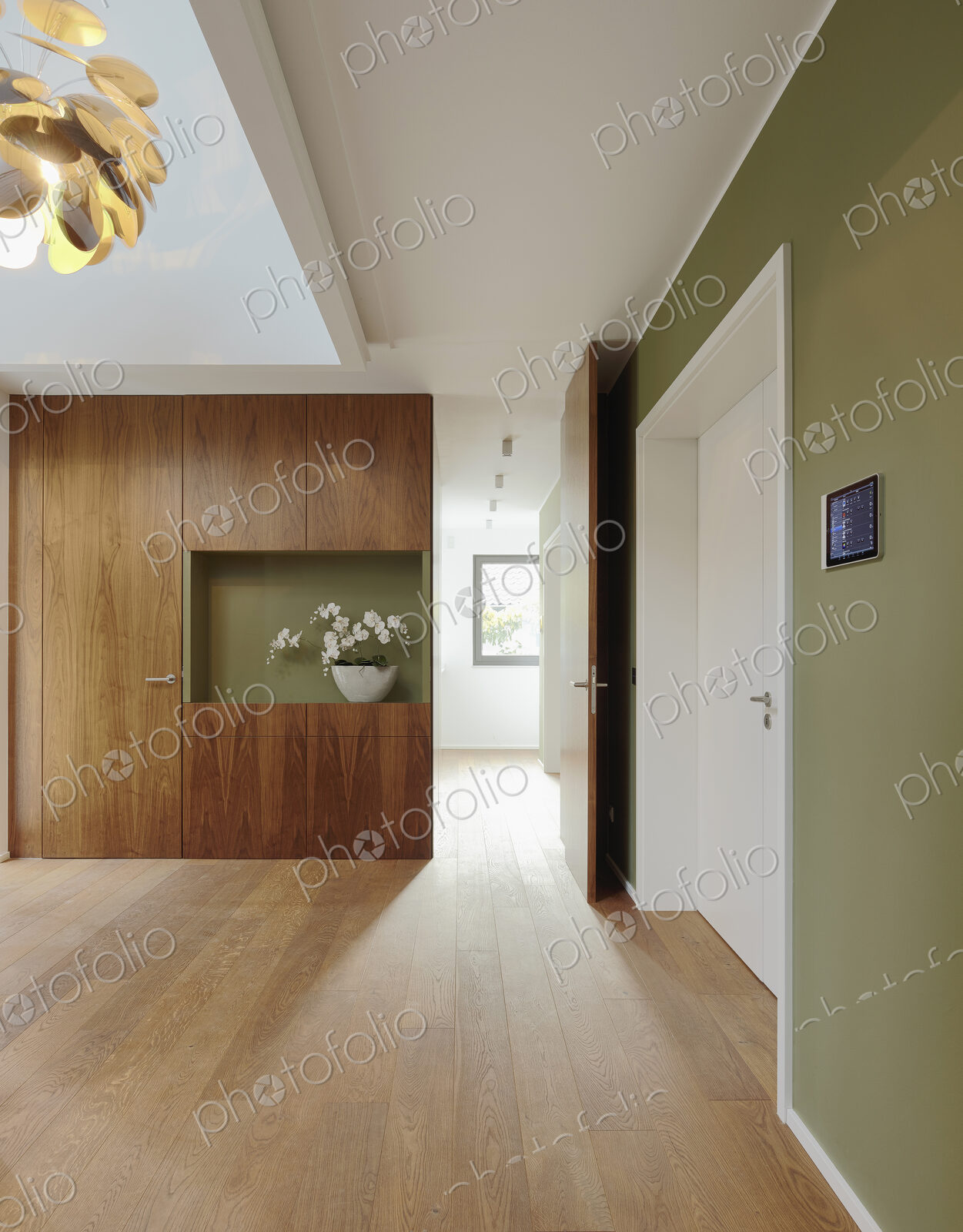 Plank floor and walnut wall covering in home