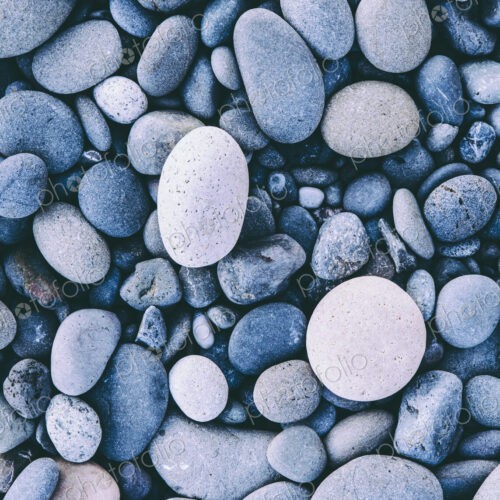 Polished smooth stones and pebbles on the sea shore, in Olympic national park. Varied… Polished smooth stones and pebbles on the sea shore, in Olympic national park. Varied…