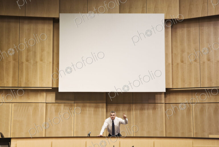 Politician making a speech at a political meeting.