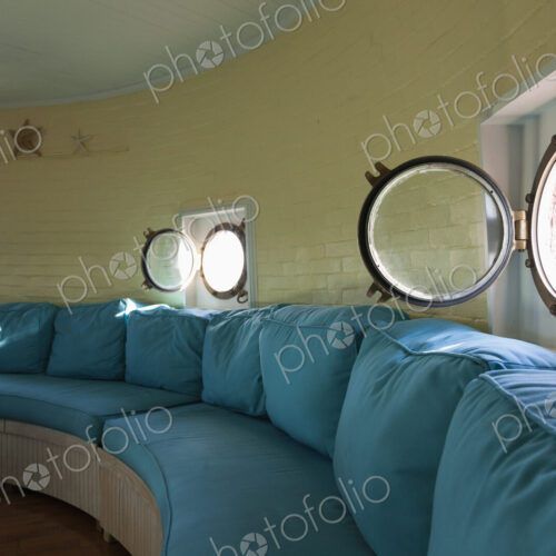 Port hole windows in round lighthouse living room Port hole windows in round lighthouse living room