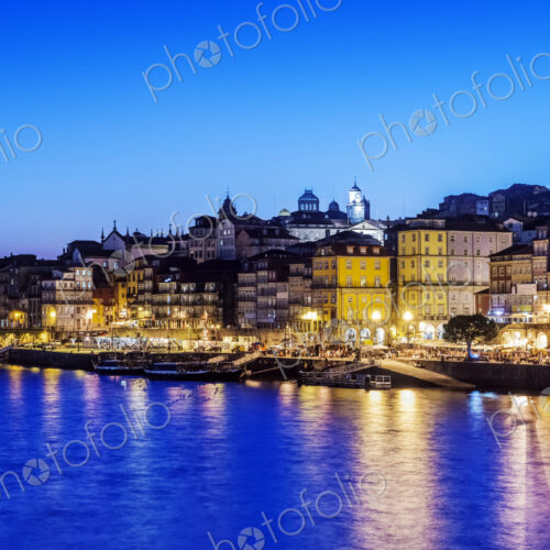 Porto cityscape and harbor illuminated at night, Porto, Portugal