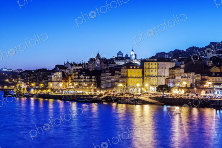 Porto cityscape and harbor illuminated at night, Porto, Portugal