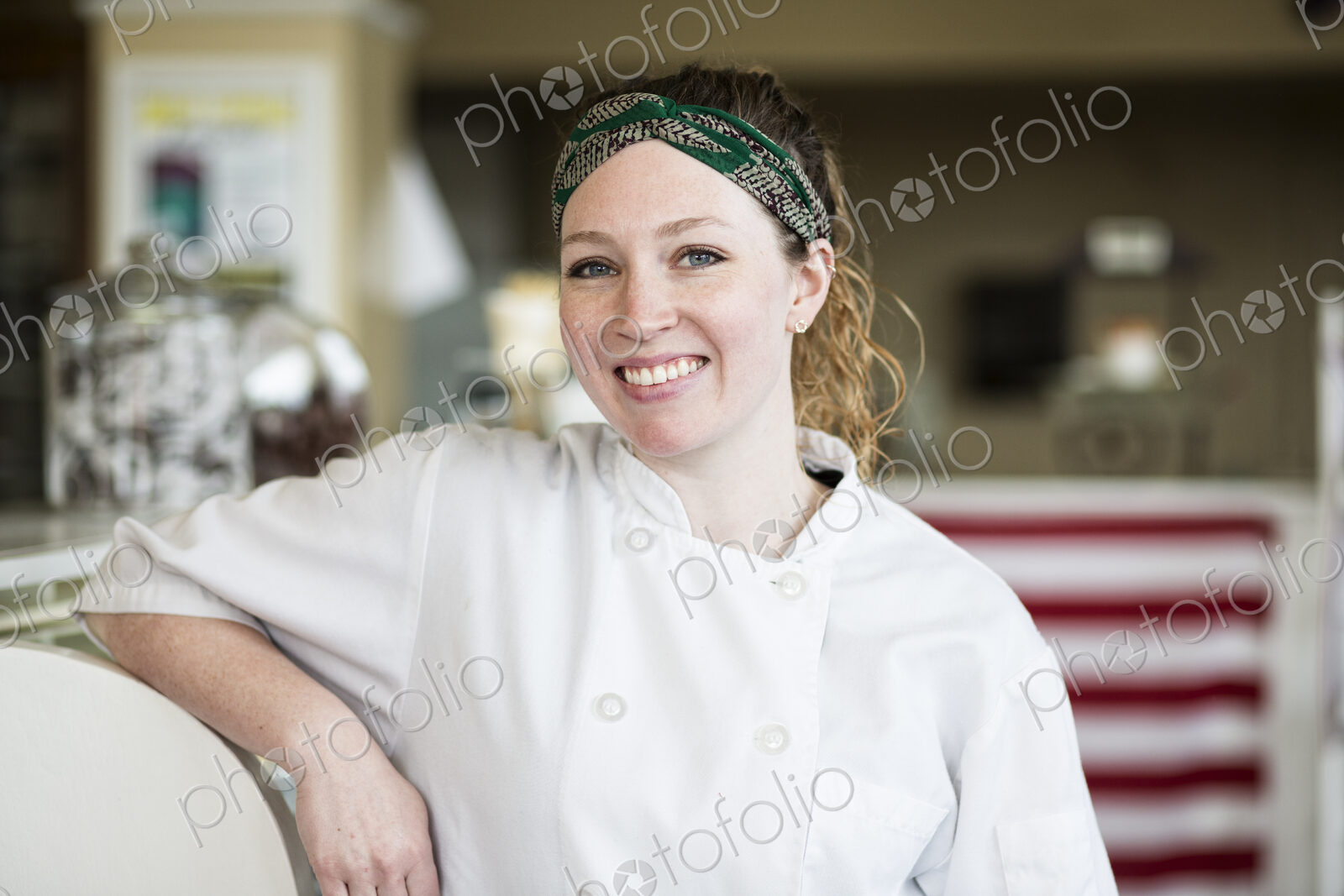 Portrait of Caucasian woman owner of a candy shop.