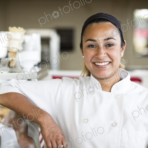 Portrait of Hispanic woman owner of a candy shop. Portrait of Hispanic woman owner of a candy shop.