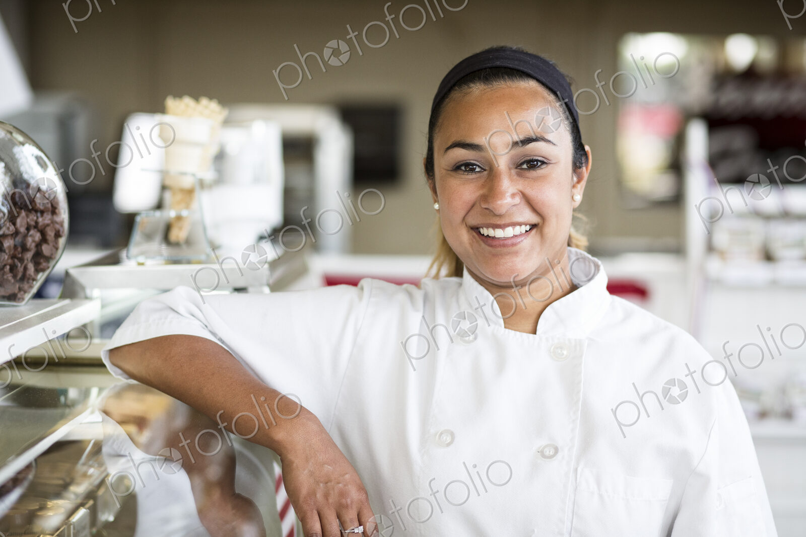 Portrait of Hispanic woman owner of a candy shop.
