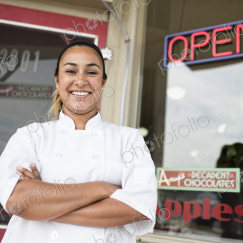 Portrait of Hispanic woman owner of a candy shop. Portrait of Hispanic woman owner of a candy shop.