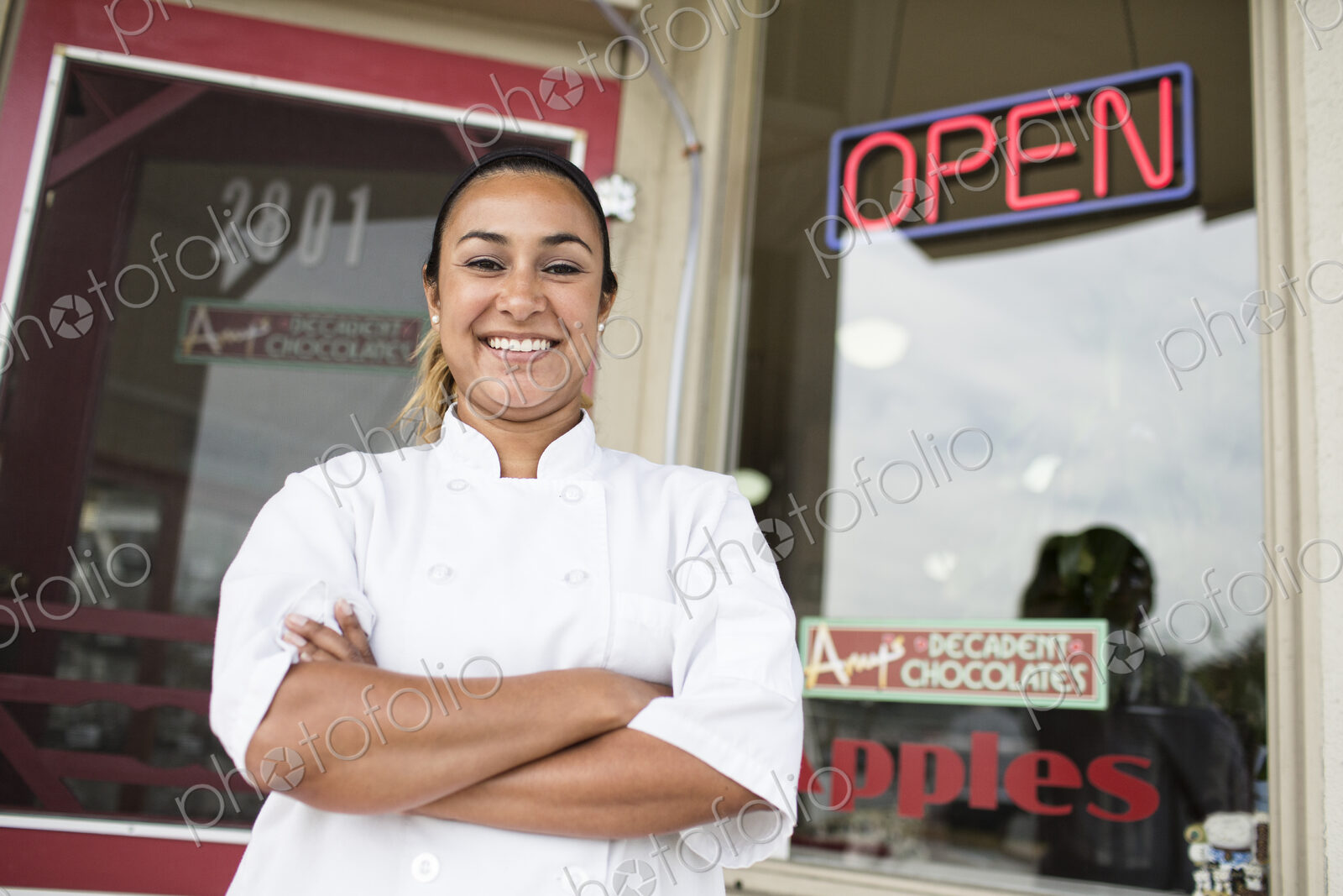 Portrait of Hispanic woman owner of a candy shop.