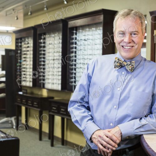 Portrait of a Caucasian male ophthalmologist in his exam office.