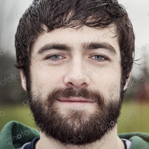 Portrait of a Caucasian man with brown hair and a beard.