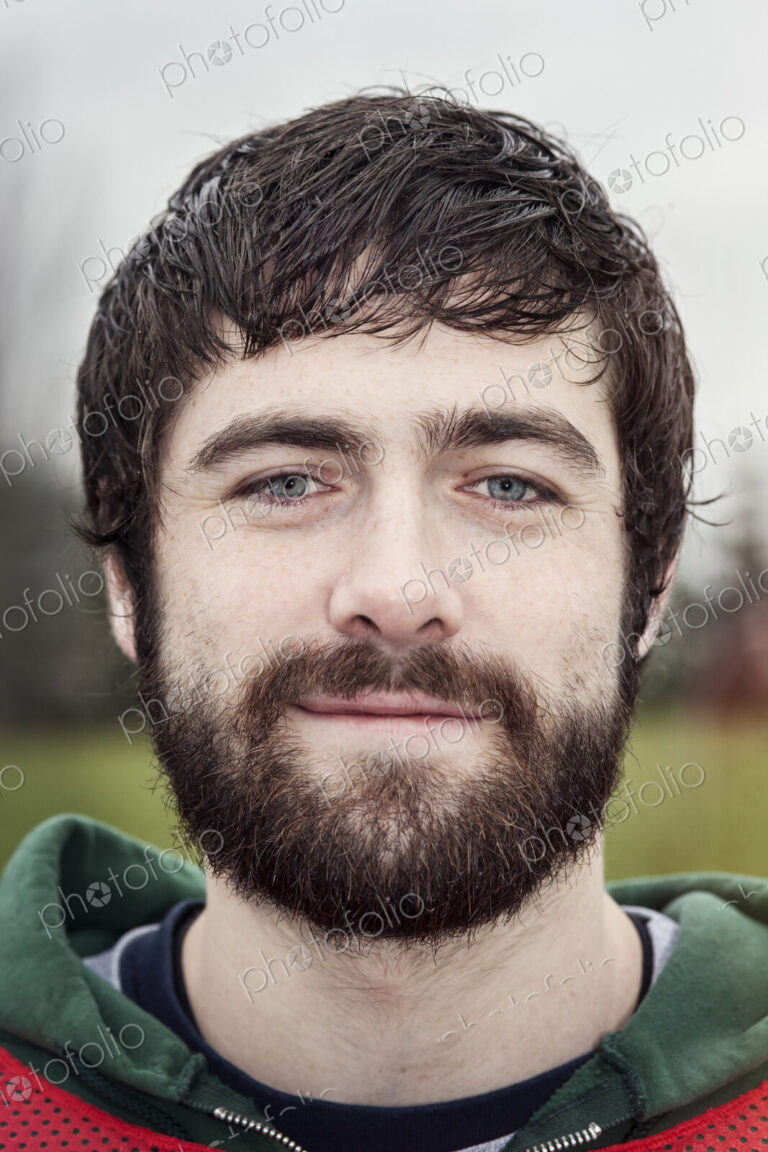 Portrait of a Caucasian man with brown hair and a beard.