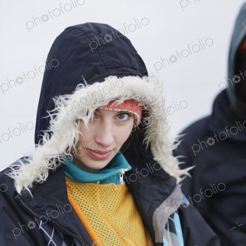 Portrait of a Caucasian woman wearing a winter coat with a fur lined hood. Portrait of a Caucasian woman wearing a winter coat with a fur lined hood.
