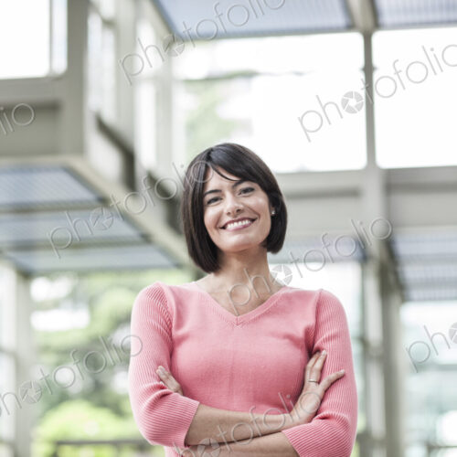 Portrait of a Hispanic businesswoman in the lobby of a convention center. Portrait of a Hispanic businesswoman in the lobby of a convention center.