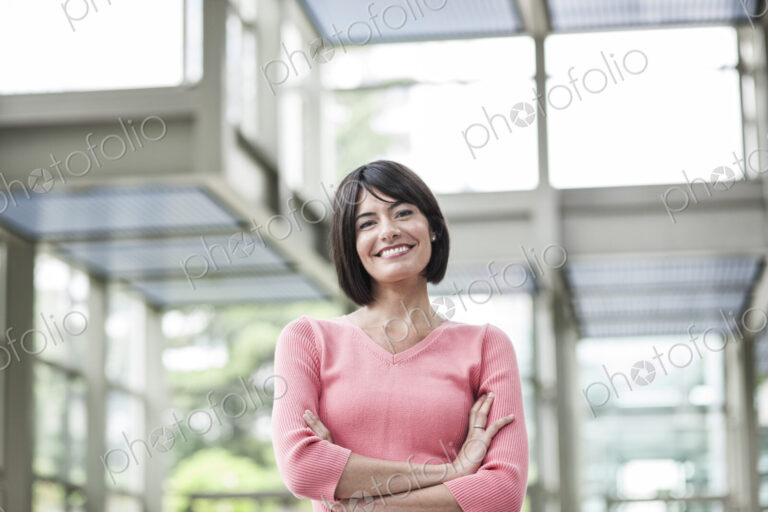 Portrait of a Hispanic businesswoman in the lobby of a convention center.