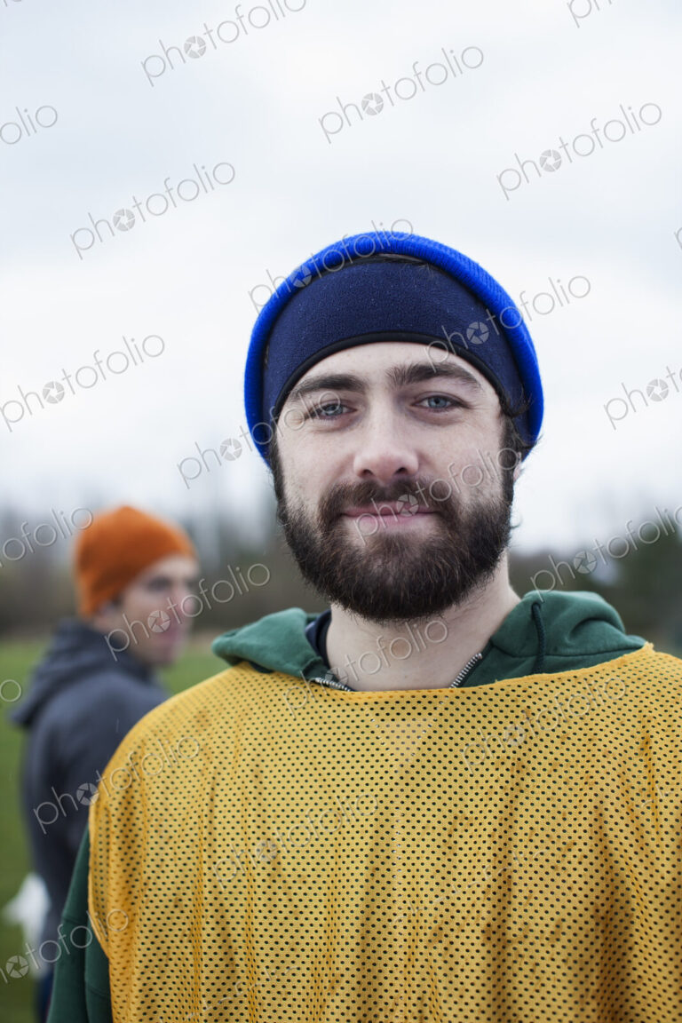 Portrait of a bearded Caucasian man in sports gear, outdoors.