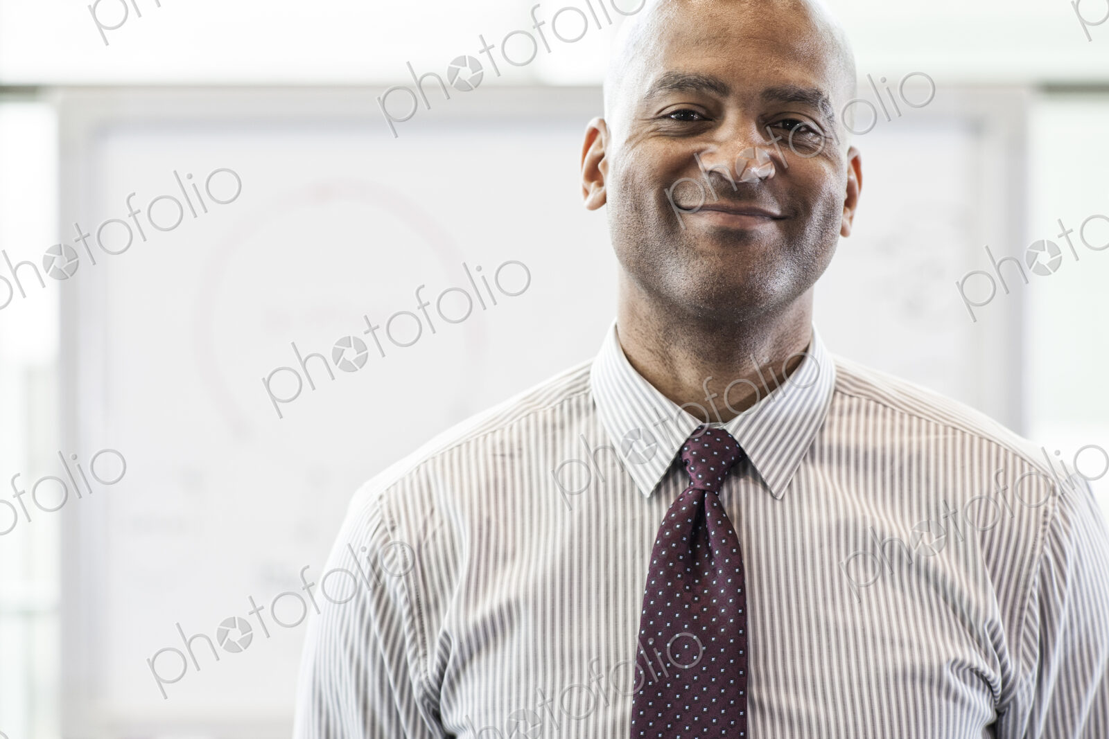 Portrait of a black businessman in the lobby of convention center.