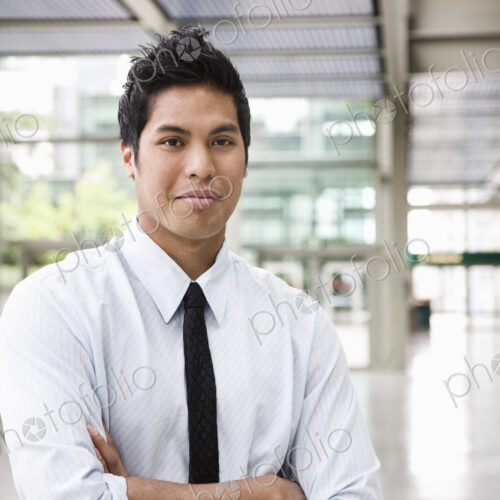 Portrait of a businessman in the lobby of a convention center. Portrait of a businessman in the lobby of a convention center.