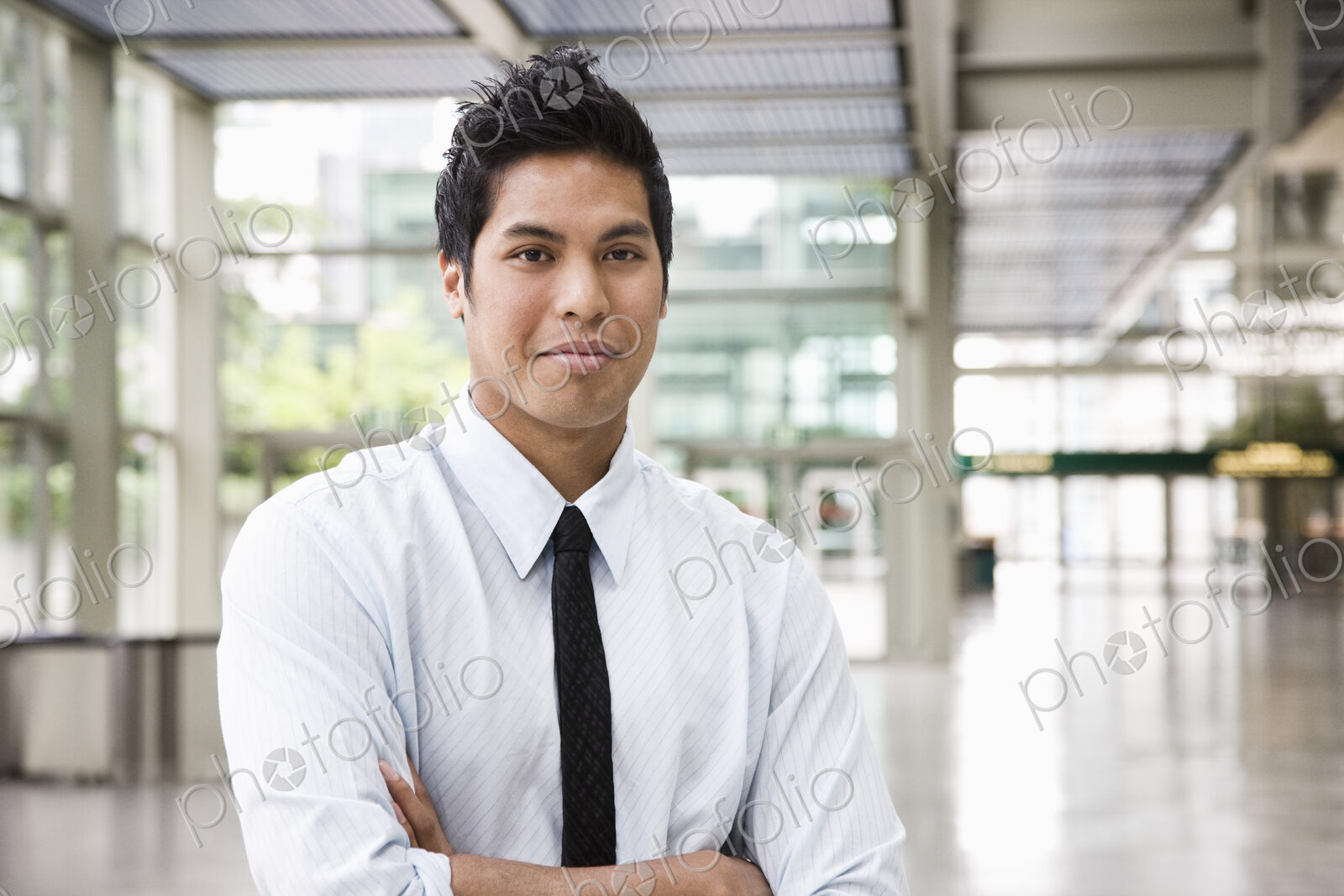 Portrait of a businessman in the lobby of a convention center.