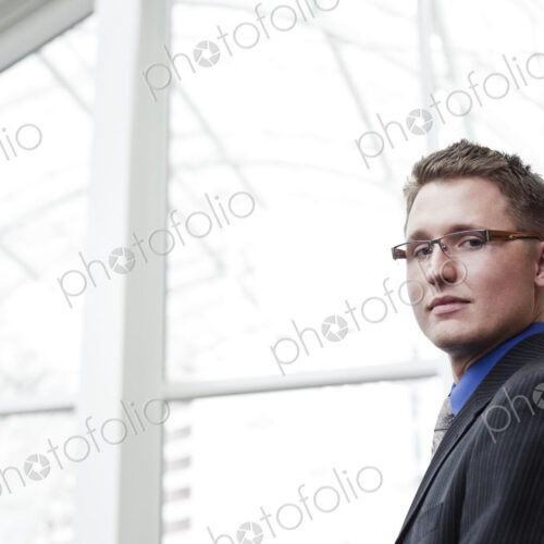 Portrait of a caucasian businessman at a convention center space. Portrait of a caucasian businessman at a convention center space.