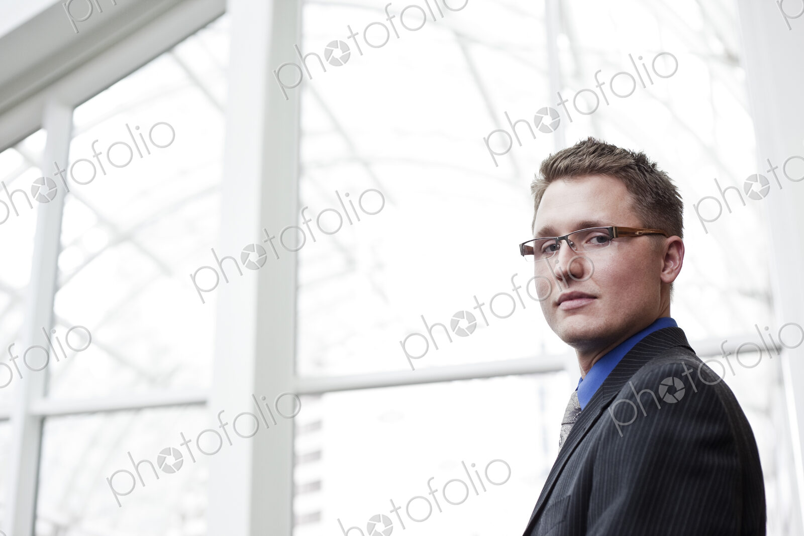 Portrait of a caucasian businessman at a convention center space.
