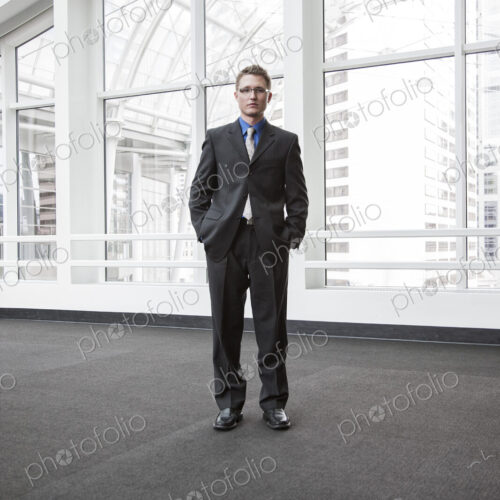 Portrait of a caucasian businessman at a convention center space. Portrait of a caucasian businessman at a convention center space.