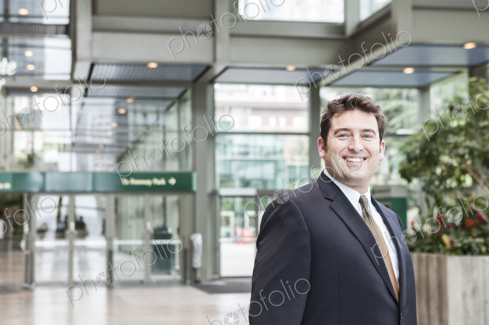Portrait of a caucasian businessman at a convention center space.
