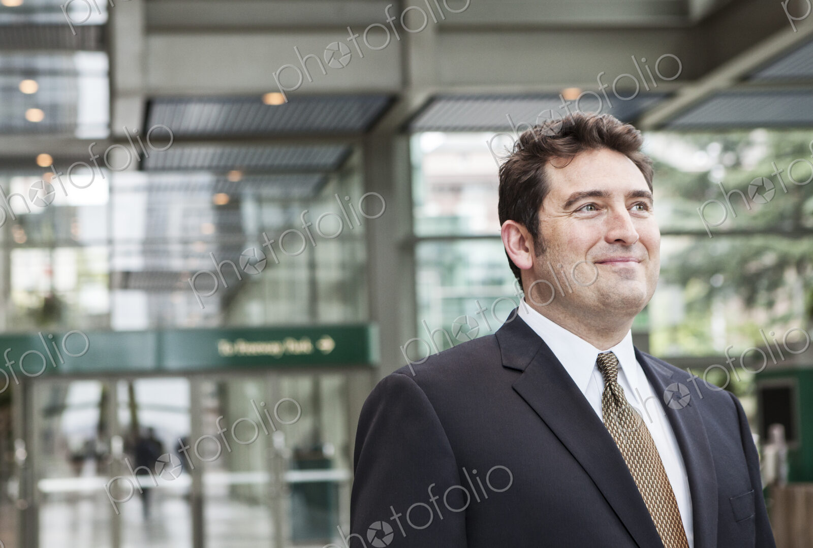 Portrait of a caucasian businessman at a convention center space.