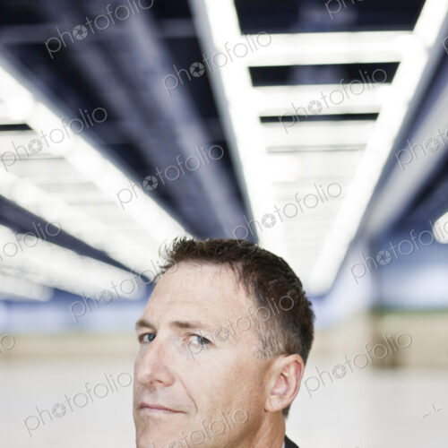Portrait of a caucasian businessman in a convention center space.