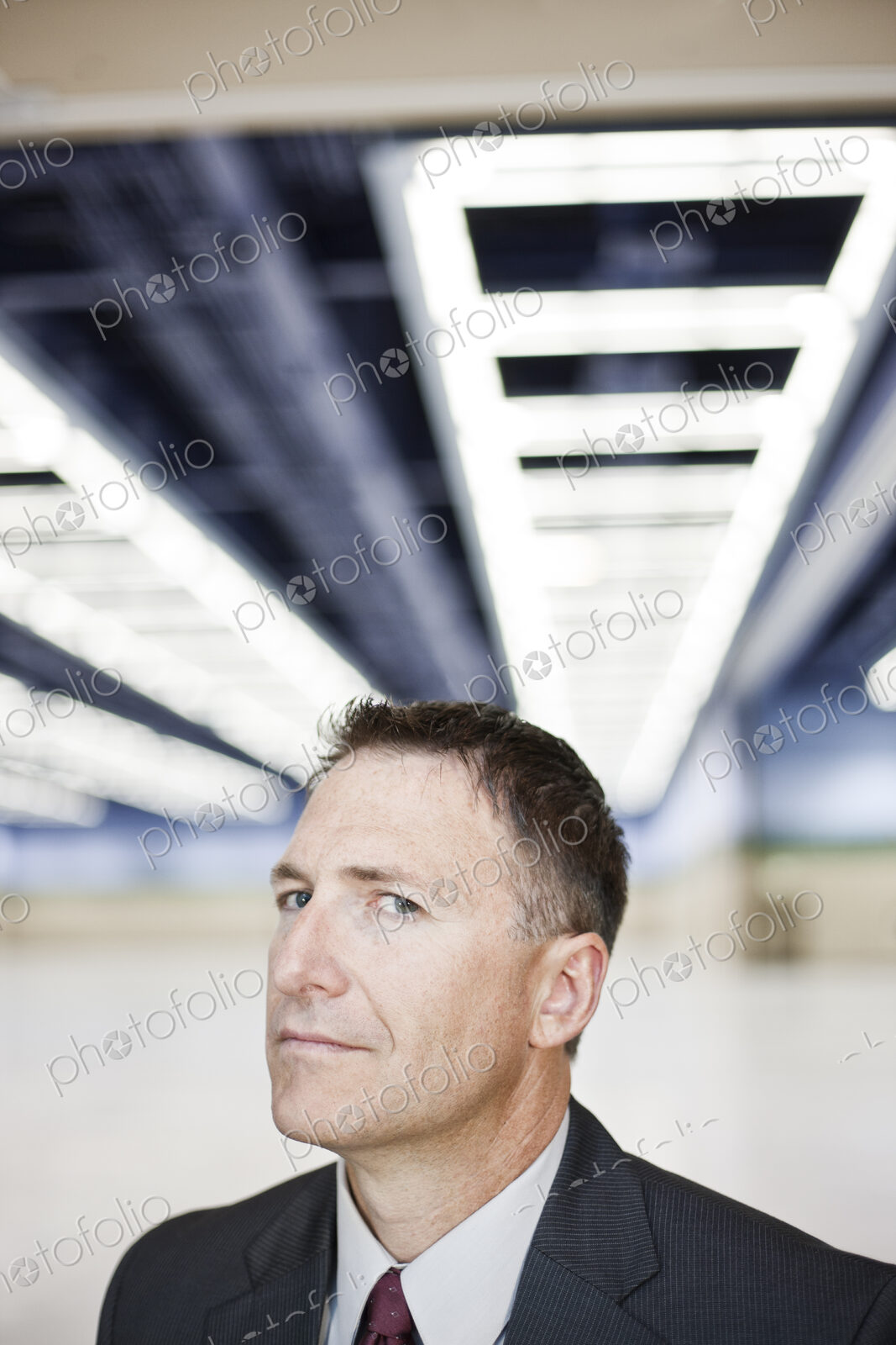 Portrait of a caucasian businessman in a convention center space.