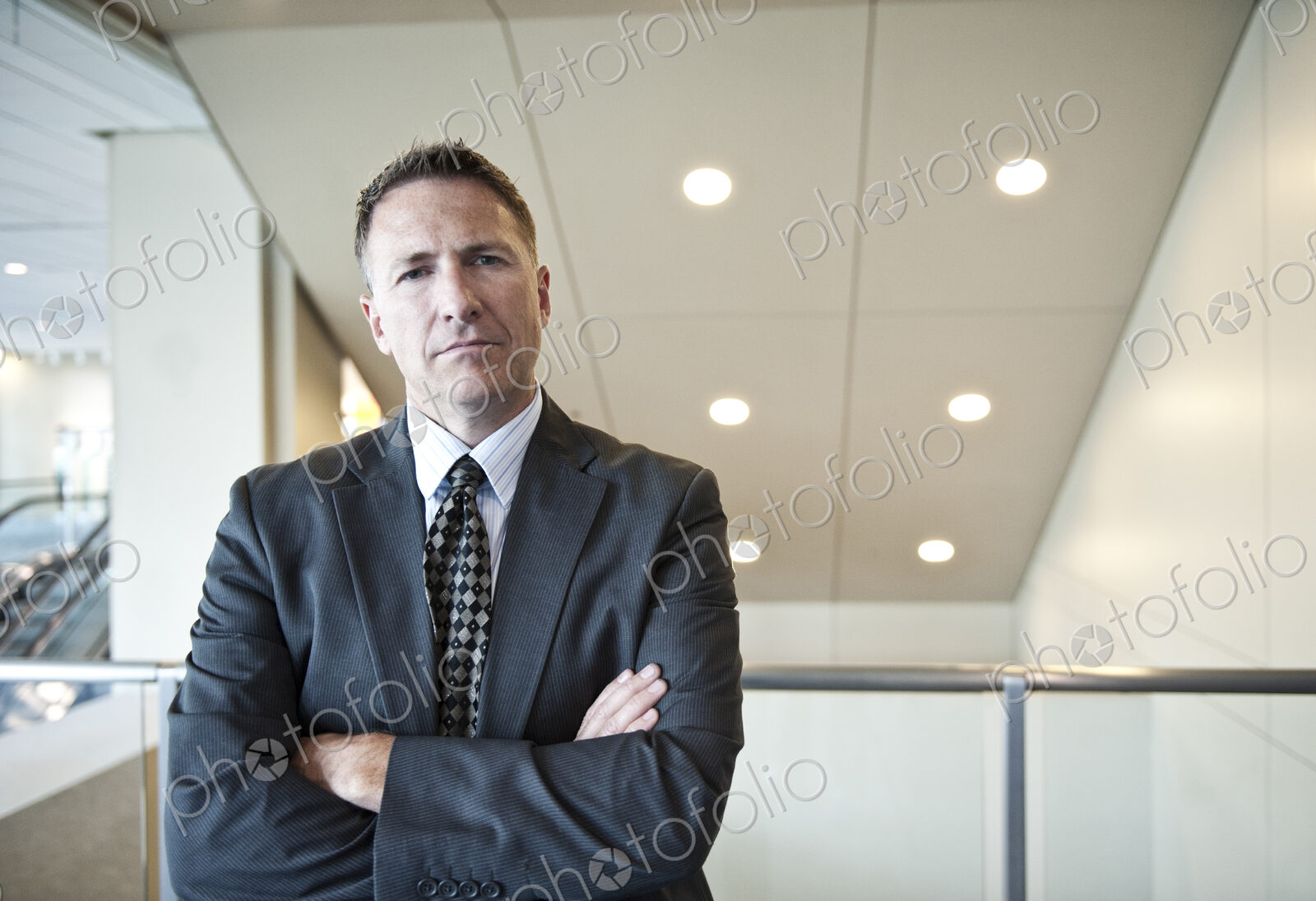 Portrait of a caucasian businessman in a convention center space.