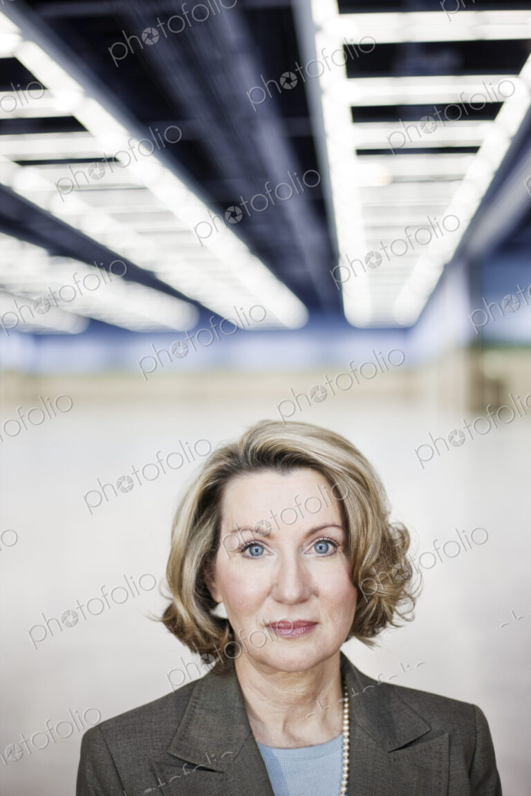 Portrait of a caucasian businesswoman in a convention center space.