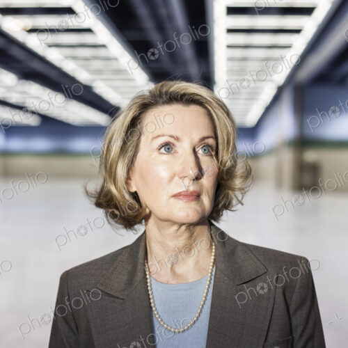 Portrait of a caucasian businesswoman in a convention center space. Portrait of a caucasian businesswoman in a convention center space.