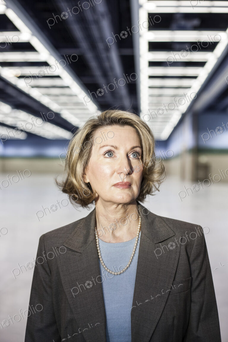 Portrait of a caucasian businesswoman in a convention center space.
