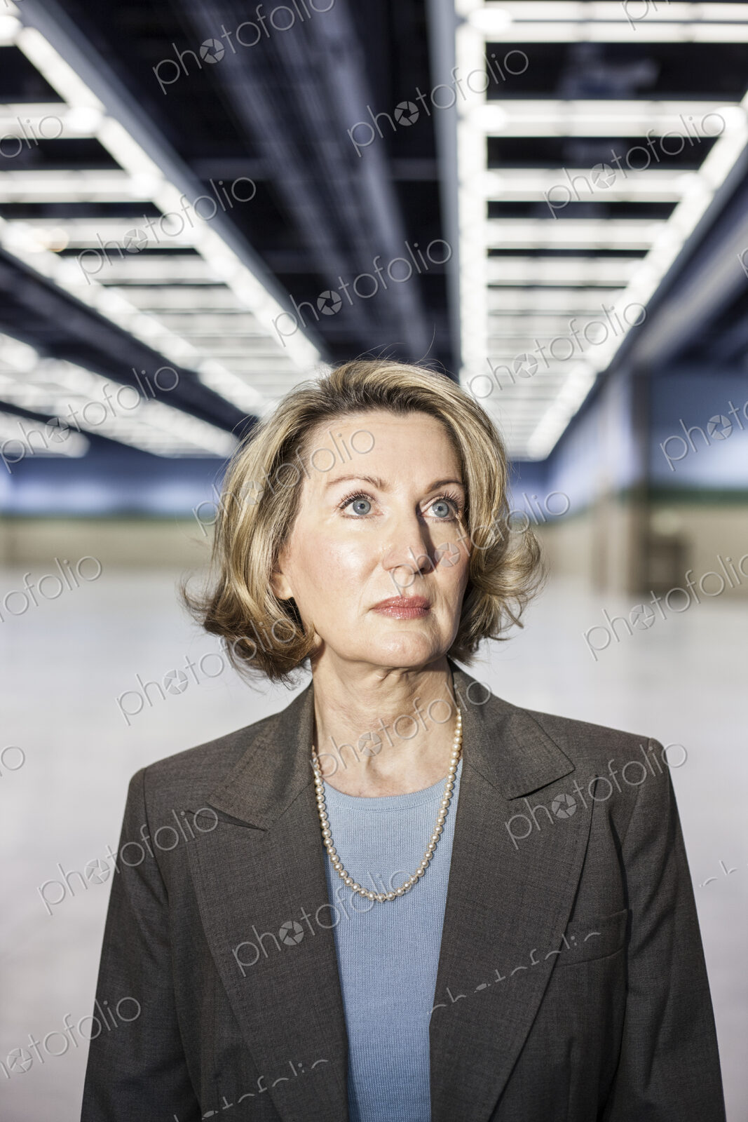 Portrait of a caucasian businesswoman in a convention center space.