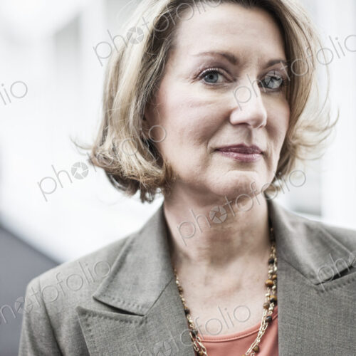 Portrait of a caucasian businesswoman in a convention center space. Portrait of a caucasian businesswoman in a convention center space.