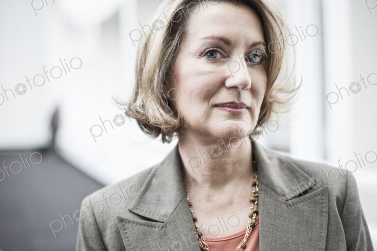 Portrait of a caucasian businesswoman in a convention center space.