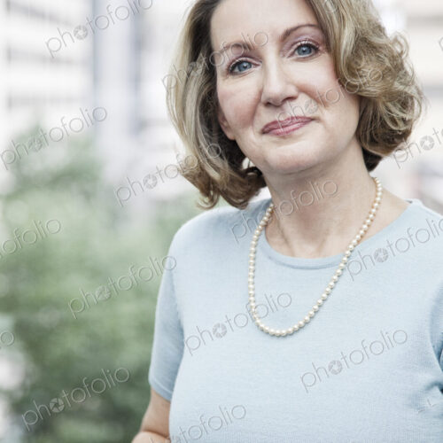 Portrait of a caucasian businesswoman in a convention center space. Portrait of a caucasian businesswoman in a convention center space.