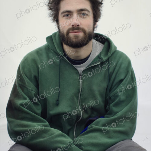 Portrait of a caucasian man in jogging pants and a sweatshirt hoodie. Portrait of a caucasian man in jogging pants and a sweatshirt hoodie.