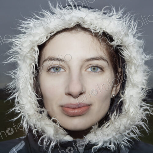 Portrait of a caucasian woman wearing a winter coat.