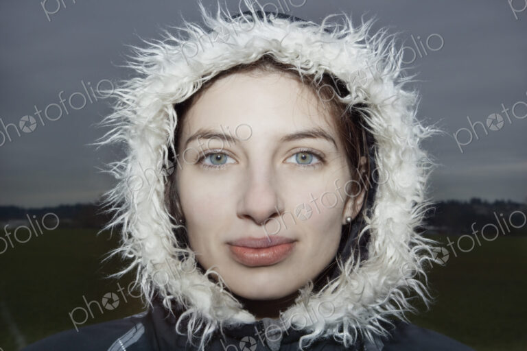 Portrait of a caucasian woman wearing a winter coat.