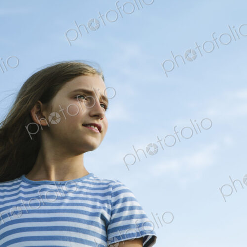 Portrait of a confident and happy nine year old girl outdoors. Portrait of a confident and happy nine year old girl outdoors.