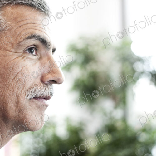 Portrait of a middle eastern businessman in an convention center lobby.