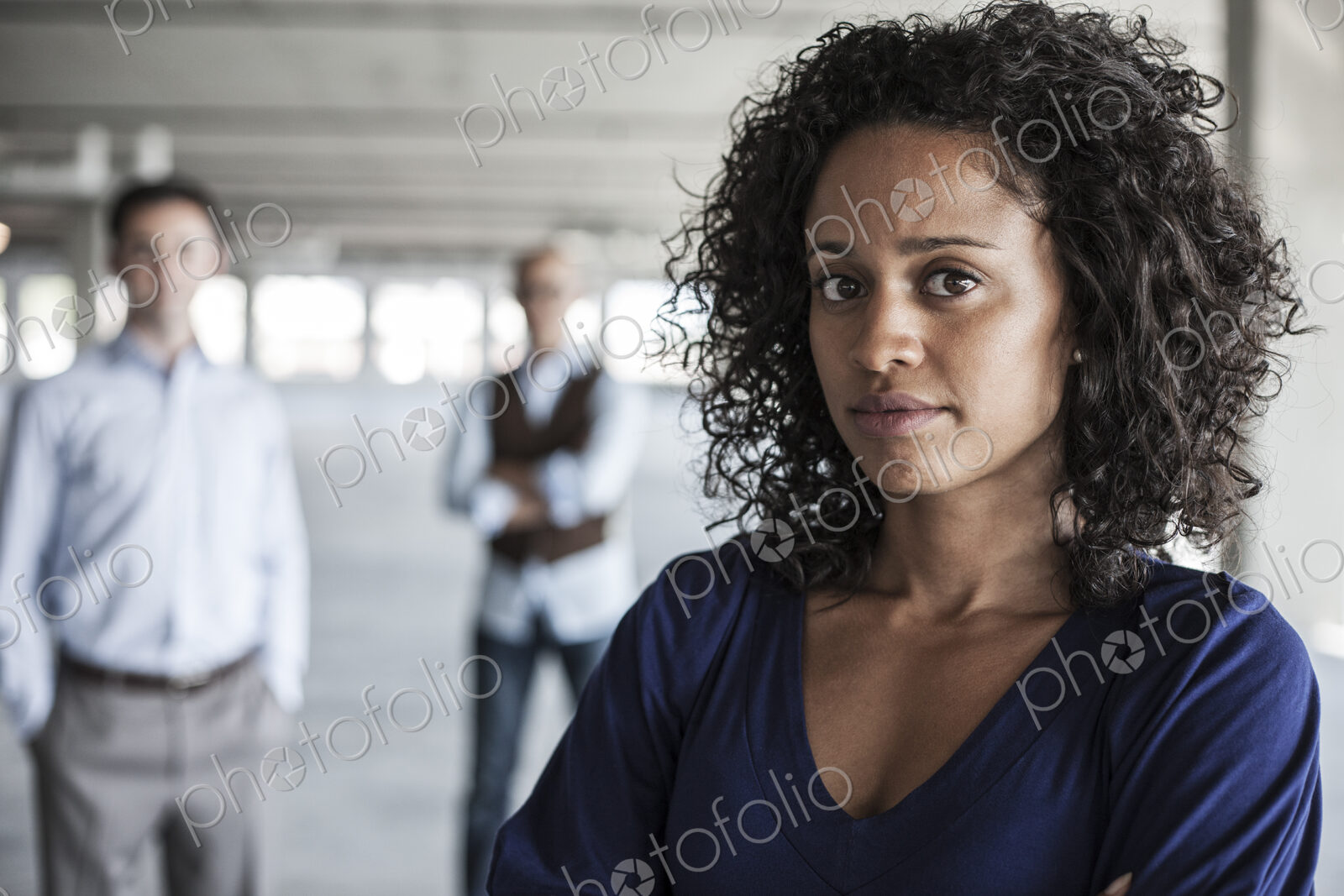 Portrait of a mixed race team of business people in a new empty office space.