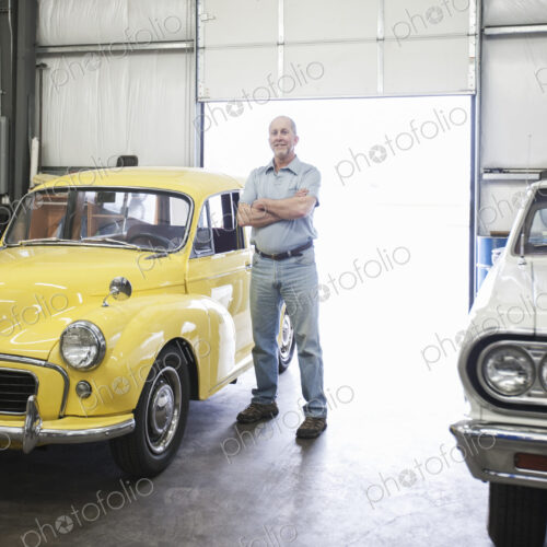 Portrait of a senior caucasian male owner of an antique car repair shop Portrait of a senior caucasian male owner of an antique car repair shop