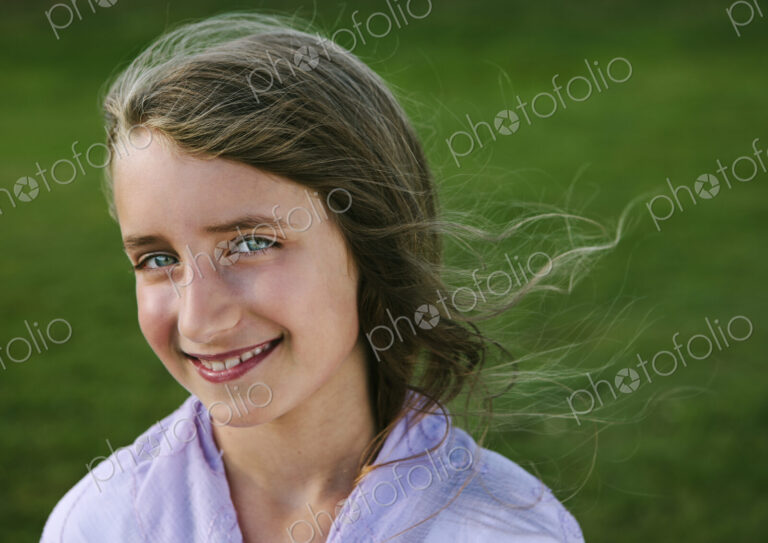 Portrait of a smiling nine year old girl.