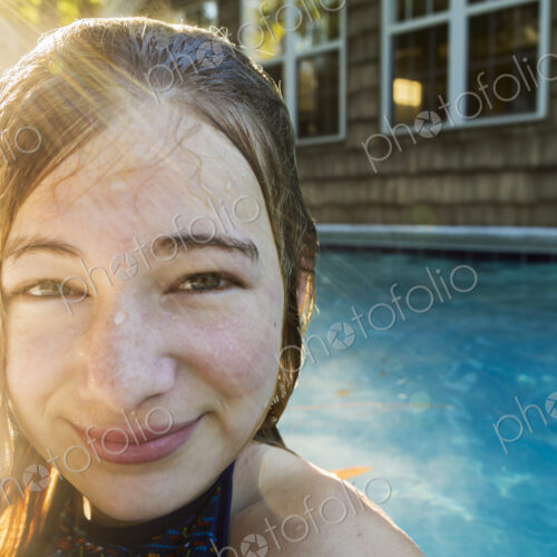 Portrait of a teenage girl in a swimming pool, head and shoulders