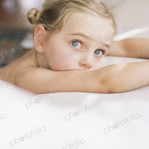Portrait of a young girl with blond hair, looking at camera. Portrait of a young girl with blond hair, looking at camera.