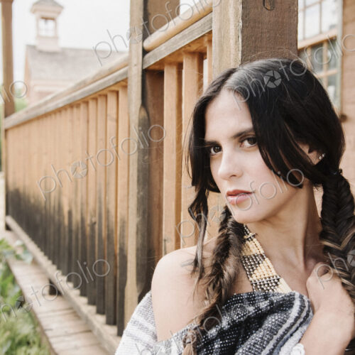 Portrait of a young woman with long brown hair in braids. Portrait of a young woman with long brown hair in braids.