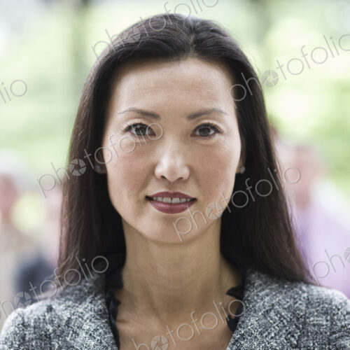 Portrait of an Asian businesswoman in the lobby of a convention center. Portrait of an Asian businesswoman in the lobby of a convention center.