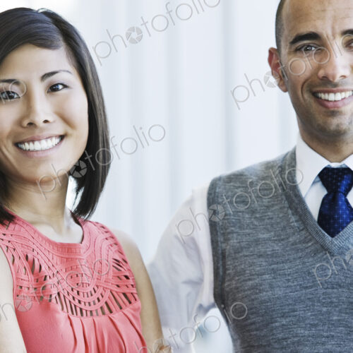 Portrait of an asian businesswoman and hispanic businessman.